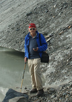 Dr. Bayr, with GPS in hand, on the Pasterze Glacier till.