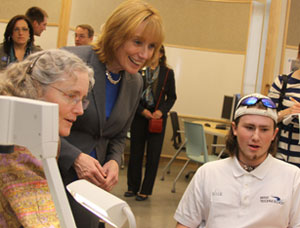 Assistant Professor Lisa Hix (left) and SPDI major Nick Bailey (right) show Governor-Elect Maggie Hassan some of the cutting-edge technology available in the TDS Center.