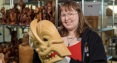 Anthropology student Isabel Falcetti holds an artifact