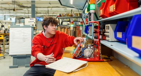 SPDI student programming a machine
